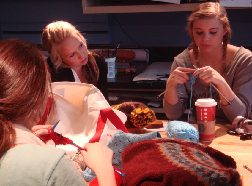 students learning to knit