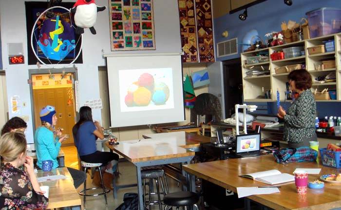 high school students watching powerpoint presentation